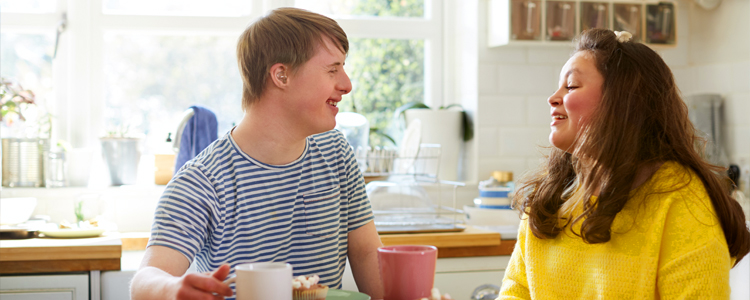 InVision Stock Man with Down Syndrome and Woman DSP in Kitchen