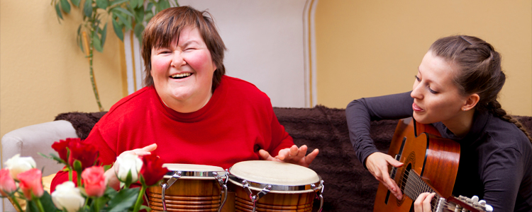 InVision Stock Two Women DSP Playing Instruments and Laughing