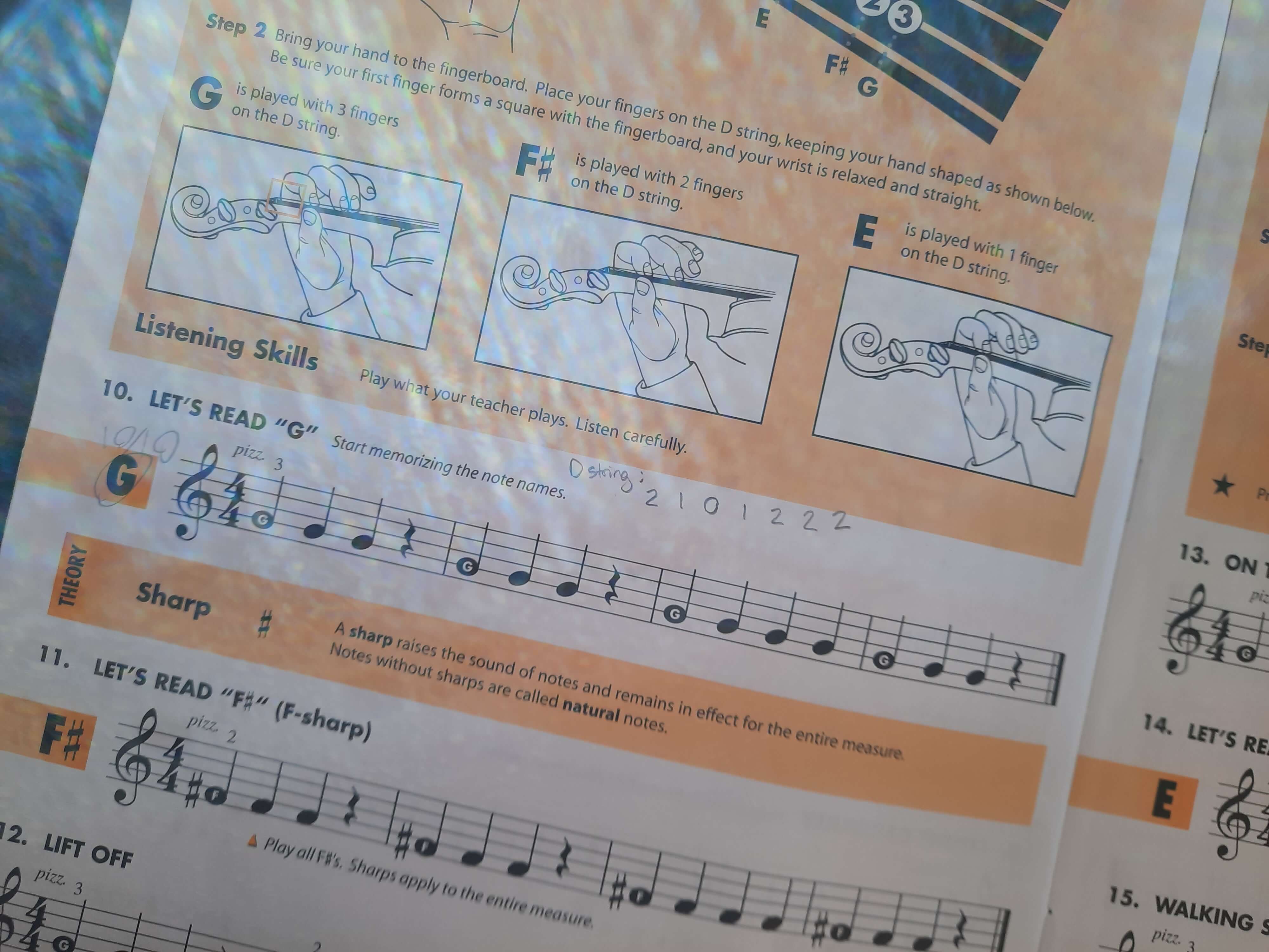 violin lesson book demonstrating proper fingering technique